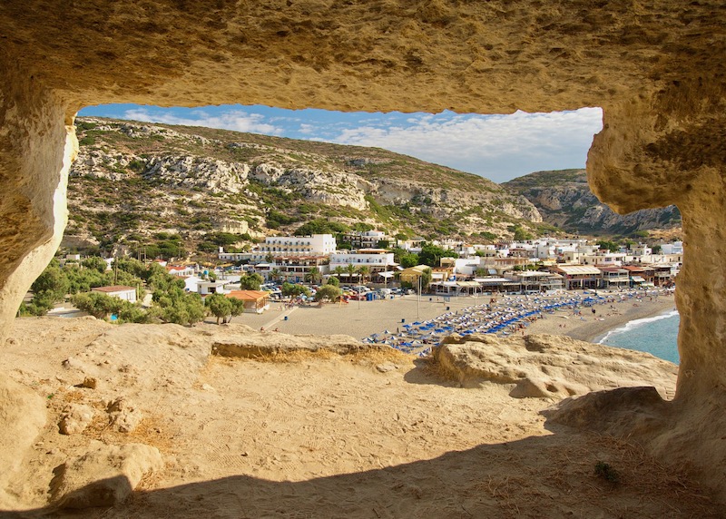 View of Matala Beach in Crete from one of the cliffside caves