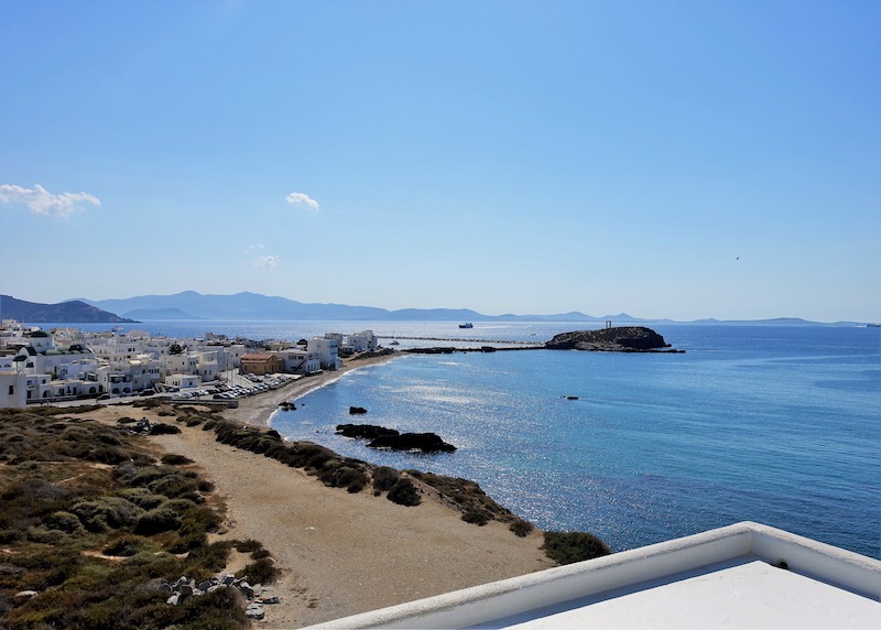 View of the Portara and Naxos Town from the roof garden of Grotta Hotel