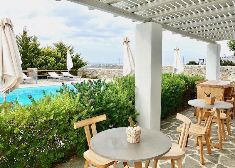 The breakfast area next to the pool at Seven Suites in Glynado, Naxos