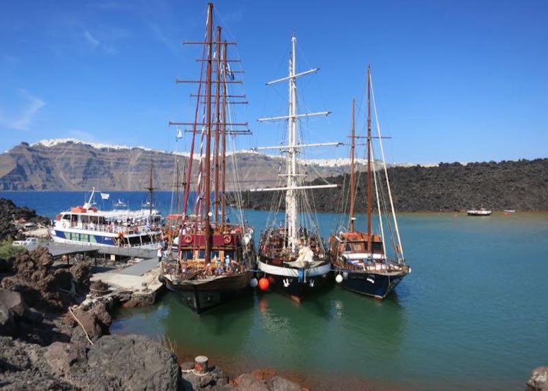 Traditional sailboats in the Santorini caldera
