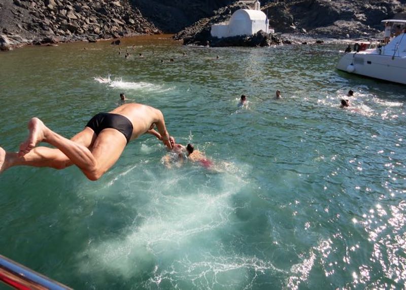 Jumping into the hot springs in the Santorini caldera