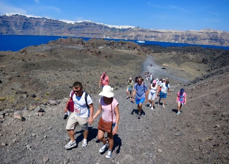 Hiking on the volcano's surface in the Santorini caldera
