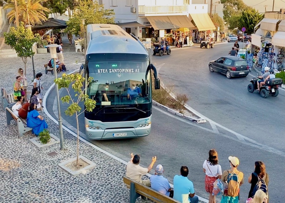 A bus at the Pyrgos bus stop in the village's main square in Santorini