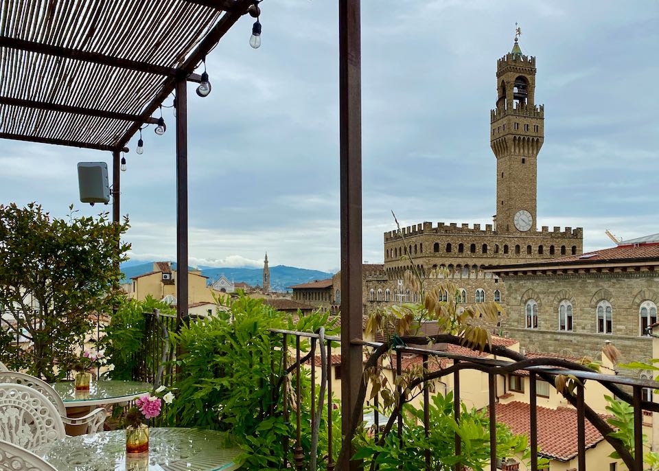View of Palazzo Vecchio from a covered rooftop seating area
