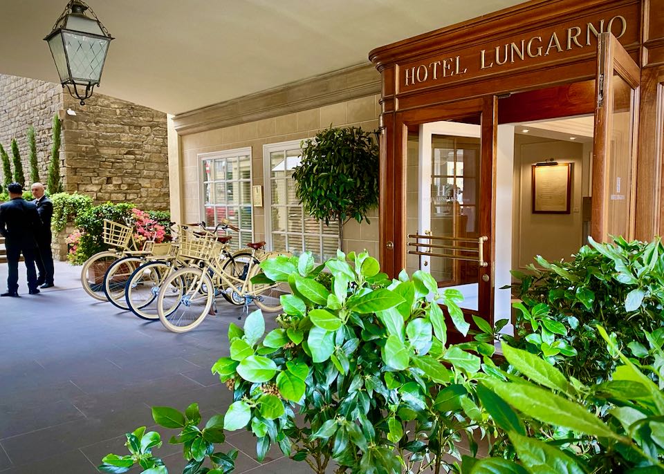 Entrance to a posh hotel with bikes parked in front