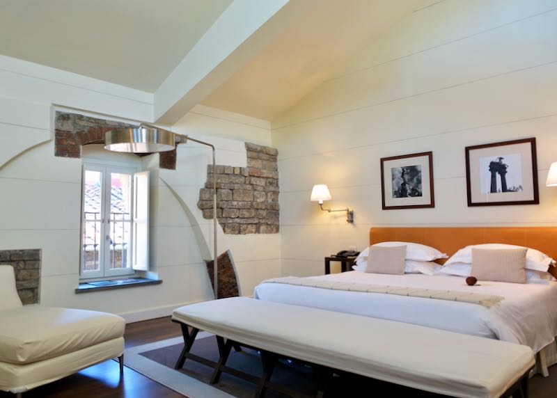 Hotel room with exposed brick walls