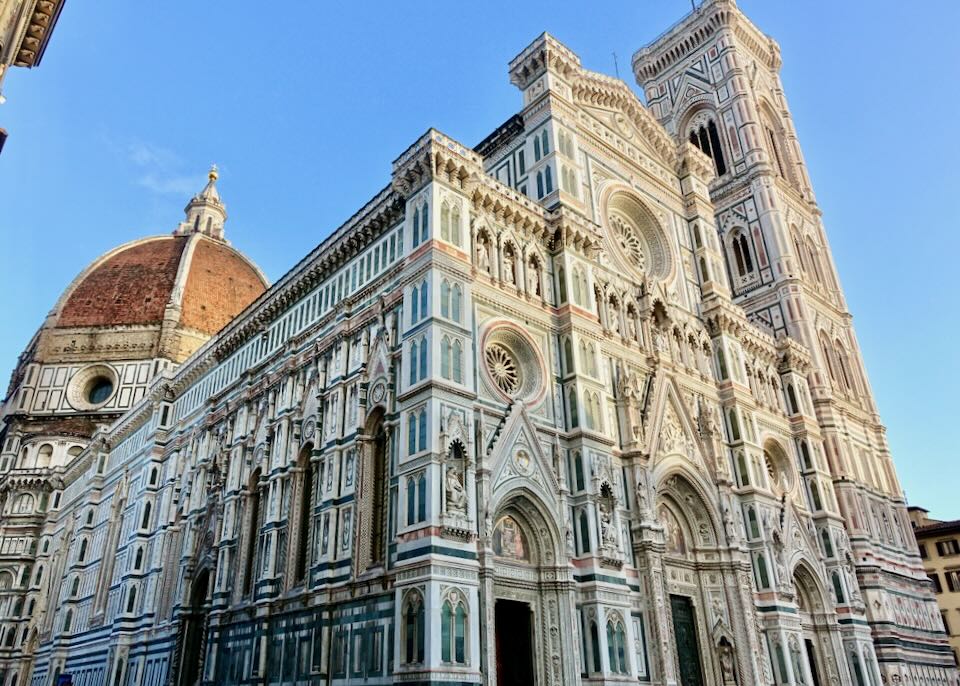 The ornate facade of San Giovanni basilica and Duomo in Florence, Italy