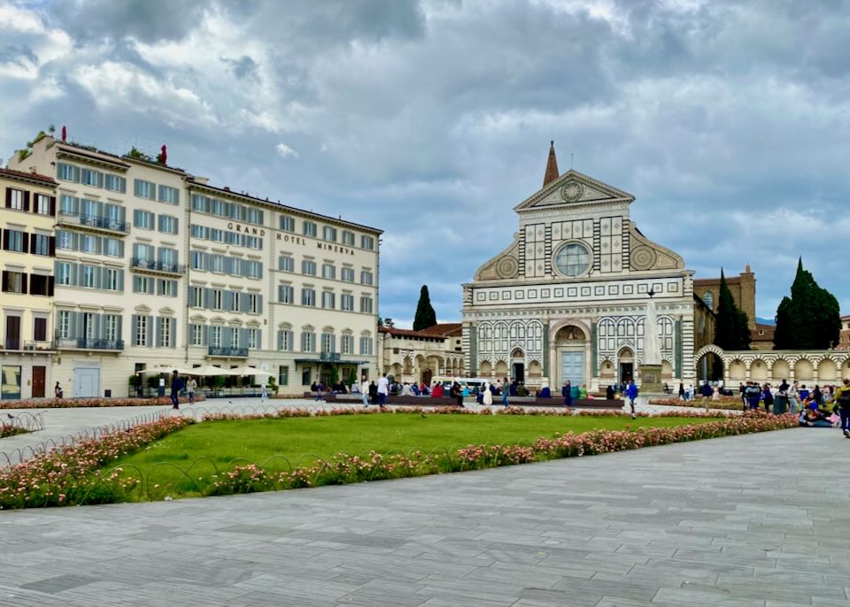 The green garden space in front of Santa Maria Novella church in Florence, Italy