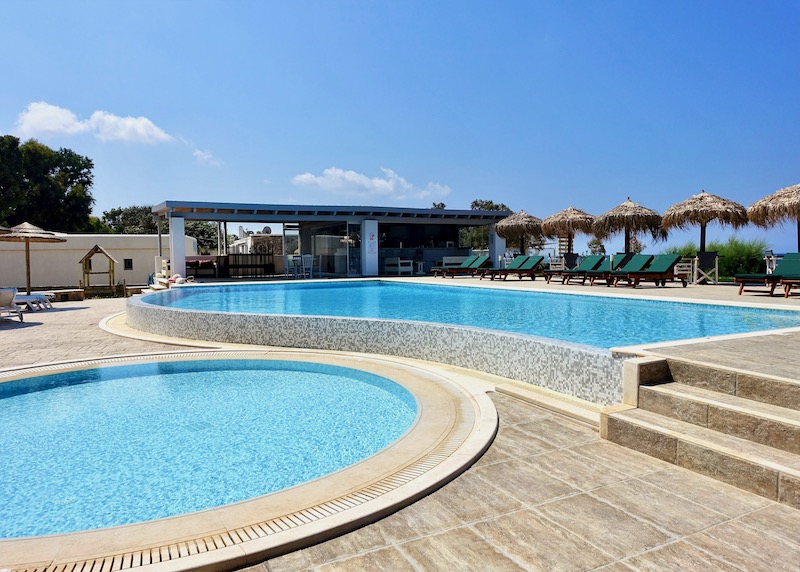 The main pool, kids pool, and snack bar at Stella Naxos Island on Plaka Beach