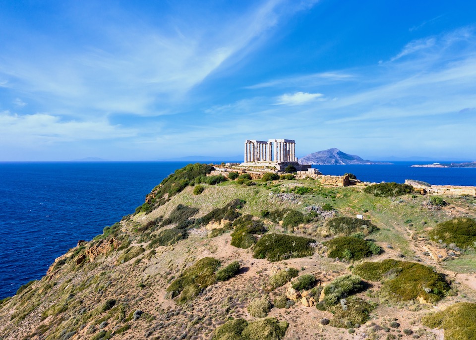 The Temple of Poseidon sits on a cliff above sea in Sounio on the Athens Riviera