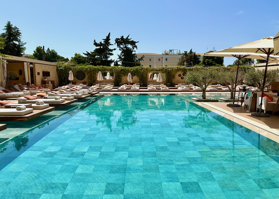 The pool surrounded by sunbeds at The Margi Boutique Hotel in Vouliagmeni on the Athens Riviera