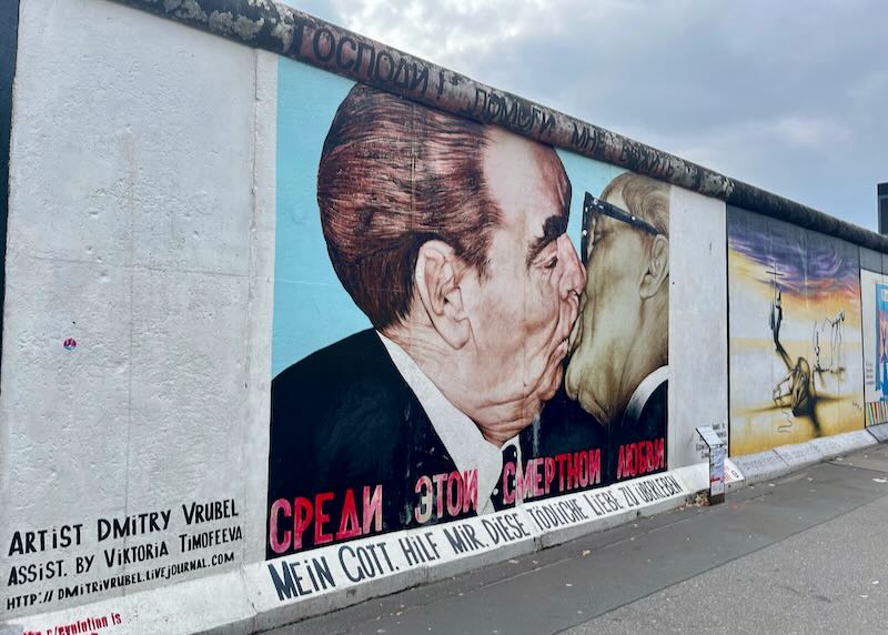 Mural of Former Soviet leader Leonid Brezhnev kissing Erich Honecker on a segment of the East Side Gallery