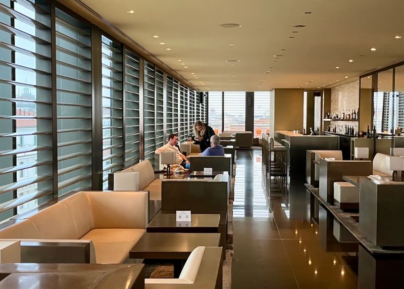 Modern hotel lounge with sleek minimalistic furnishing and oversized windows