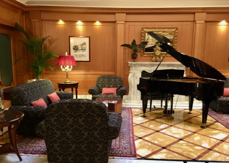 Lounge with elegant furnishing and a grand piano