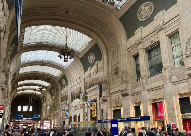 Ornate and cavernous interior of the central train station in Milan, Italy