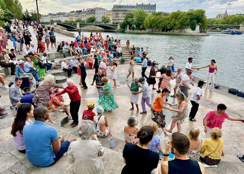 Couples dancing on the bank of the Seine in the Jardin Tino Rossi in the Latin Quarter of Paris
