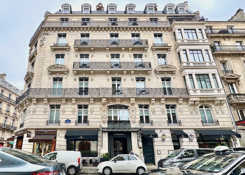 The Haussmann-style facade of the Grand Powers hotel in Paris