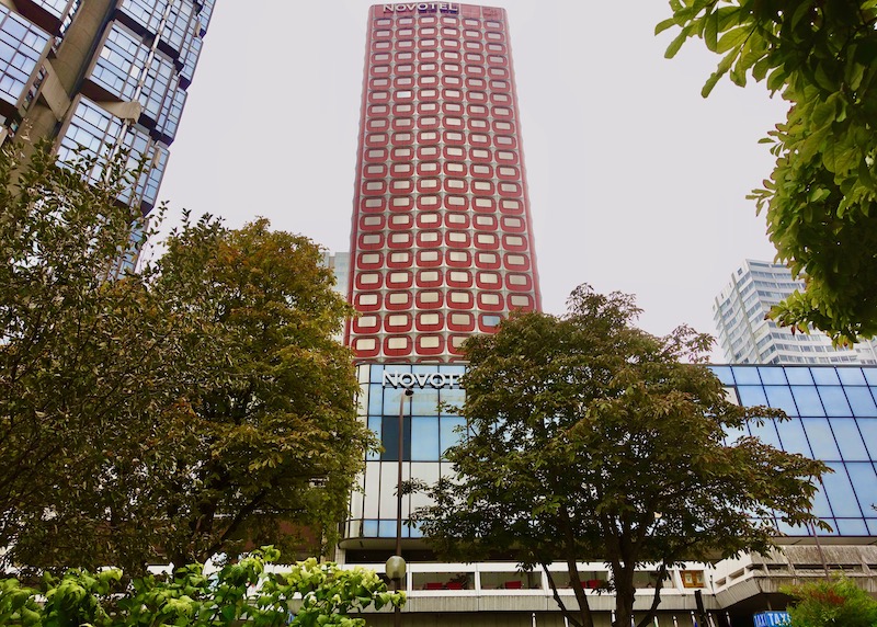 1970s architecture at the Novotel Tour Eiffel hotel in Paris with red rounded square windows making up the front of the skyscraper.