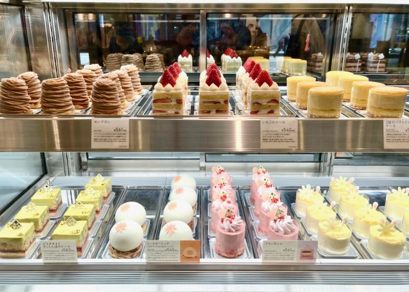 Bright and colorful individual pastries line the shelves at Andersen bakery in Hiroshima, Japan.