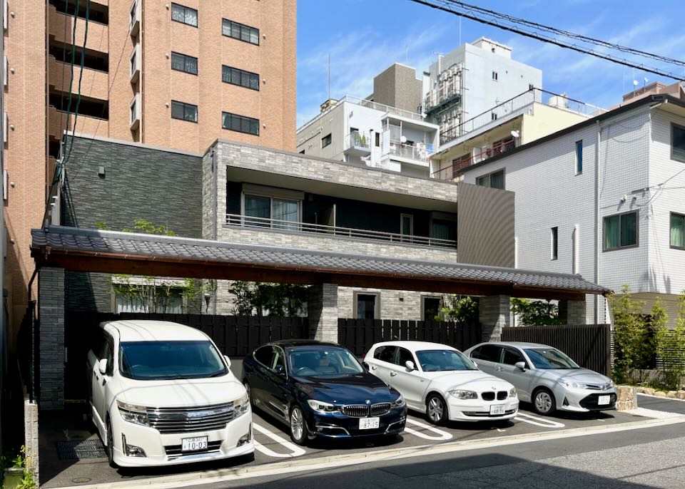 Cars are parked in front of GRAND BASE Hotel in Hiroshima.