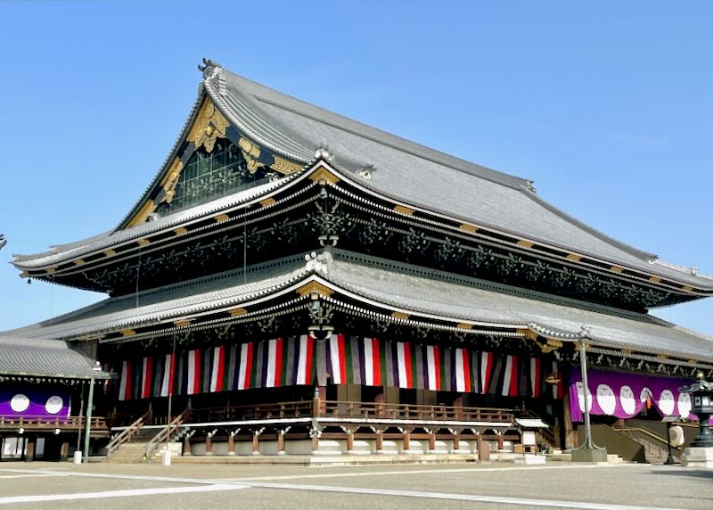A two-story temple with gold leaf trim.