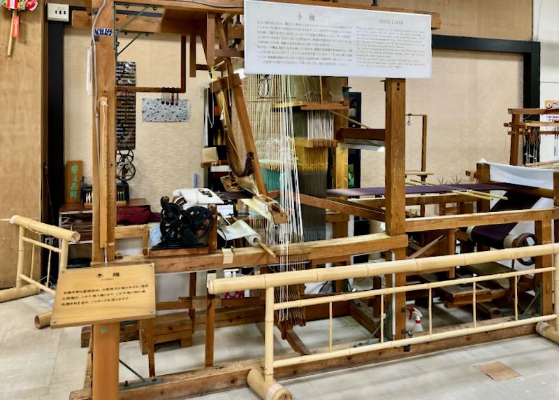 A large bamboo and wood loop is on display at the Nishijin Textile Center.