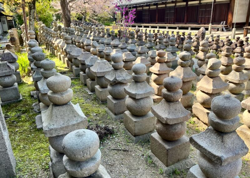 Hundred's of stone upright grave markers sit outside Gango-ji Temple.