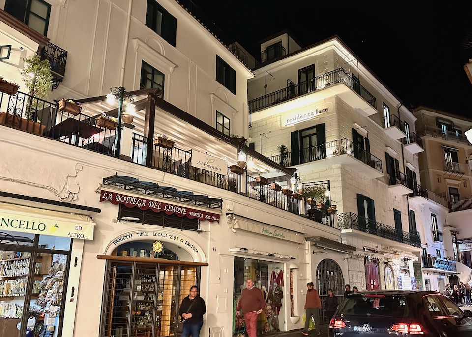 Nighttime exterior of Residenza Luce in Amalfi on the main street near restaurants and shops