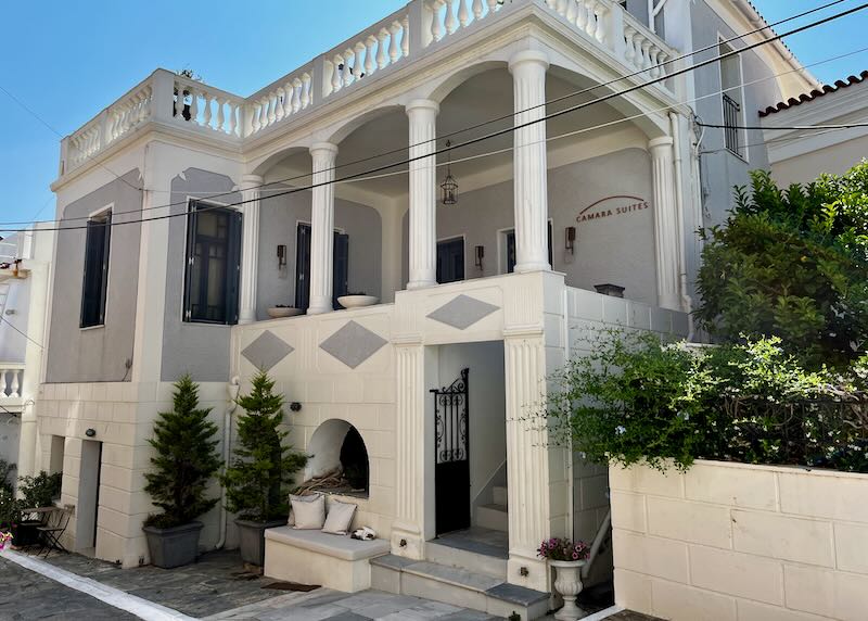 White marble mansion with a colonnaded porch