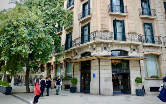 Corner view of a boutique hotel in an elegant stone building in Barcelona 