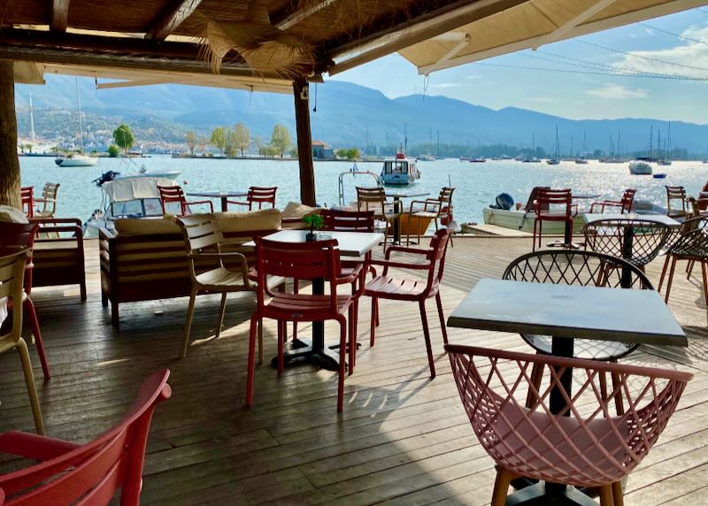 Tables at an outdoor cafe over the water