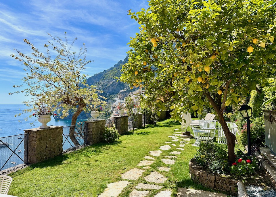 The garden terrace with a lemon tree overlooking the sea from a villa at Eden Roc hotel in Positano on the Amalfi Coast