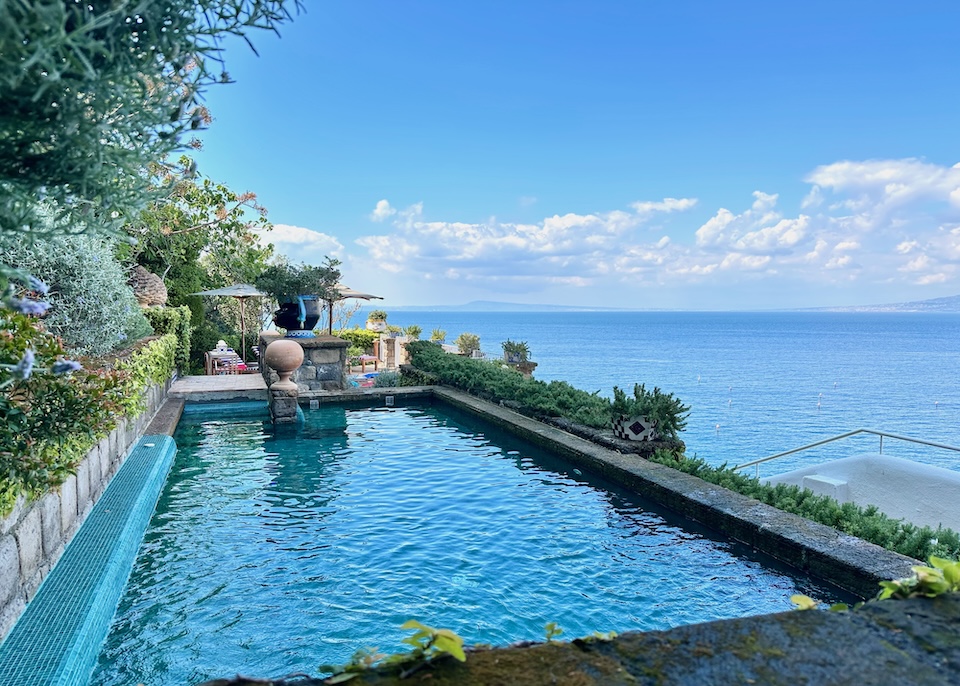 Pool on a garden terrace overlooking the sea at Maison La Minervetta in Sorrento, Italy