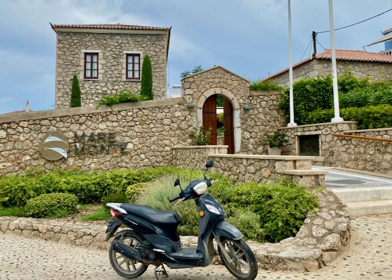 Rustic and elegant stone building with a motorcycle parked in front