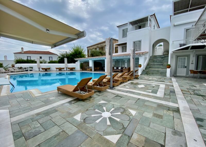 Hotel pool terrace with a stone mosaic floor