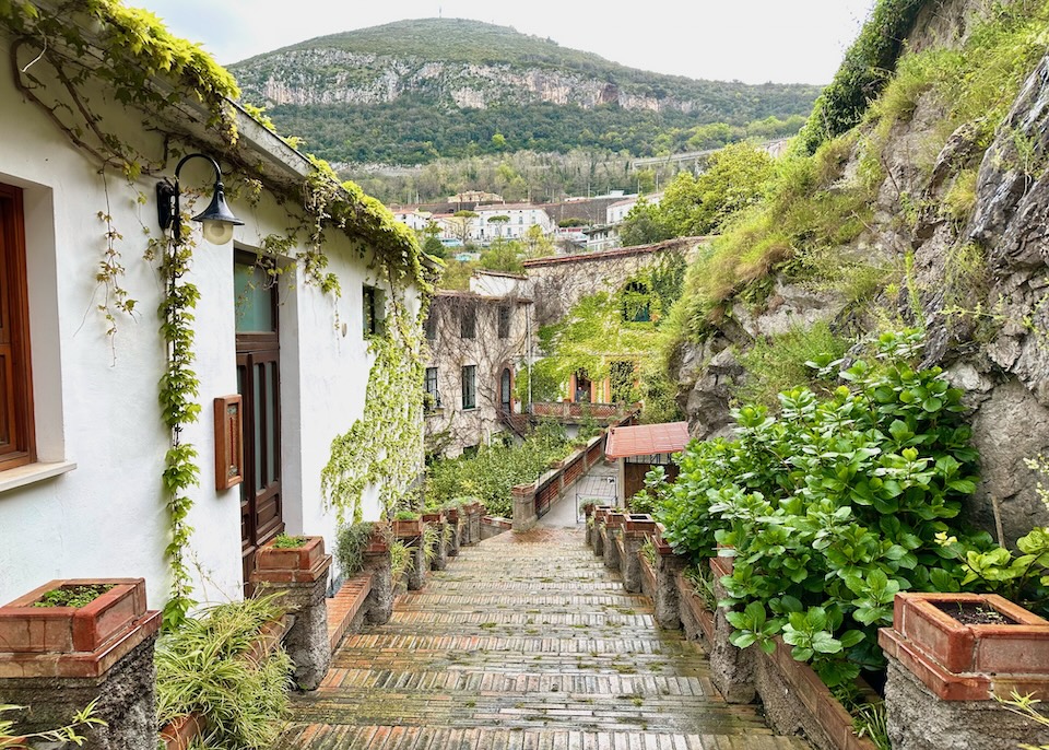 Red brick stairway at the entrance to La Valle della Najadi, a hotel the looks like a village in Vietri sul Mare on the Amalfi Coast