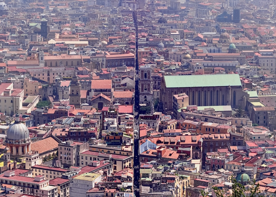 View from above the Centro Storico with the Spaccanapoli street cutting vertically through the middle in Naples, Italy