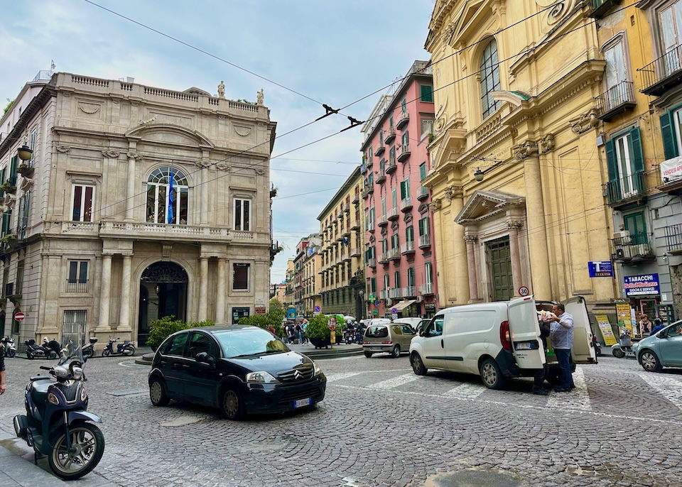Neoclassical and colorful stucco buildings on the ancient street Via Toledo in the Montecalvario neighborhood of Naples, Italy