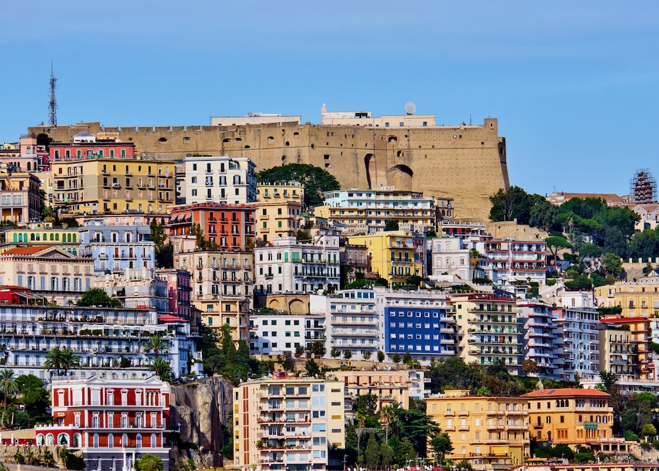 Castel Sant Elmo with colorful apartment houses on the hillside of Vomero in Naples, Italy