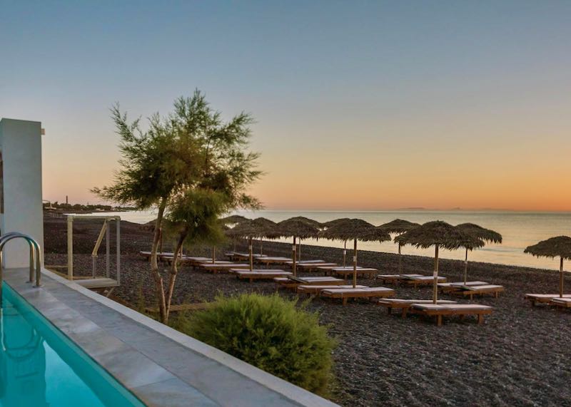 Beach resort with pool in Santorini, Greece.
