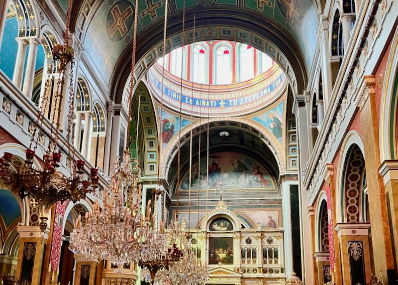 Colorful church interior with domed ceilings and chandeliers