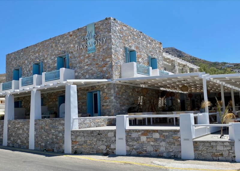 Stone Cycladic-style hotel with blue shutters