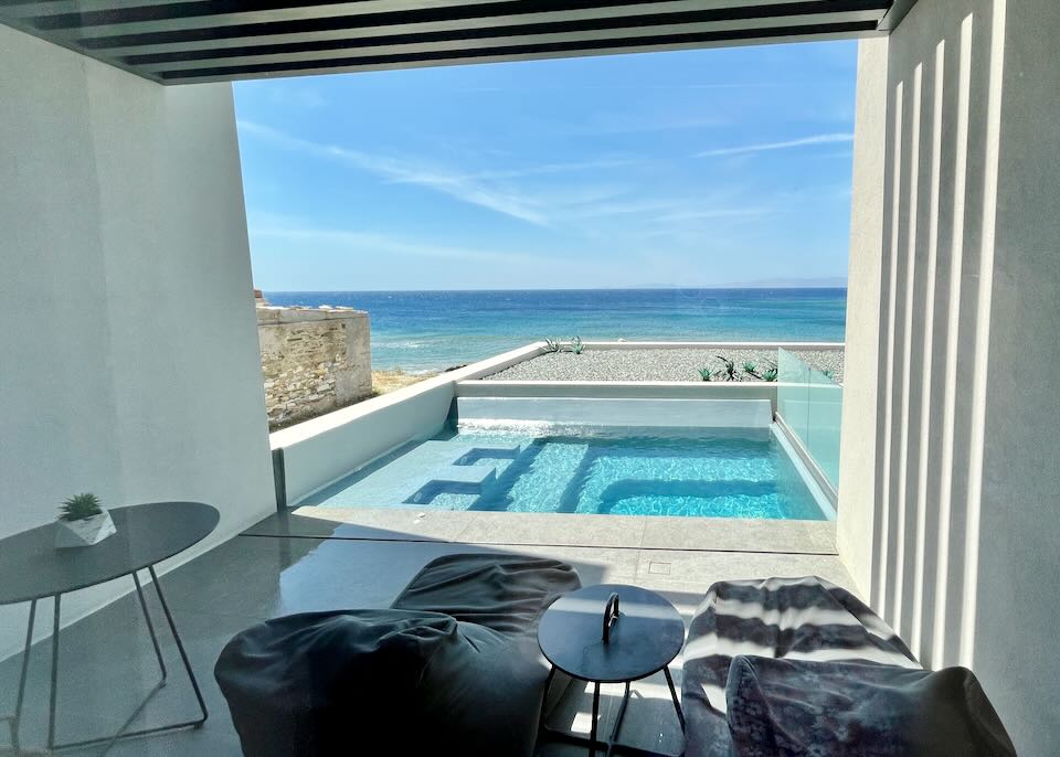 View from a furnished patio over a private pool to the sea
