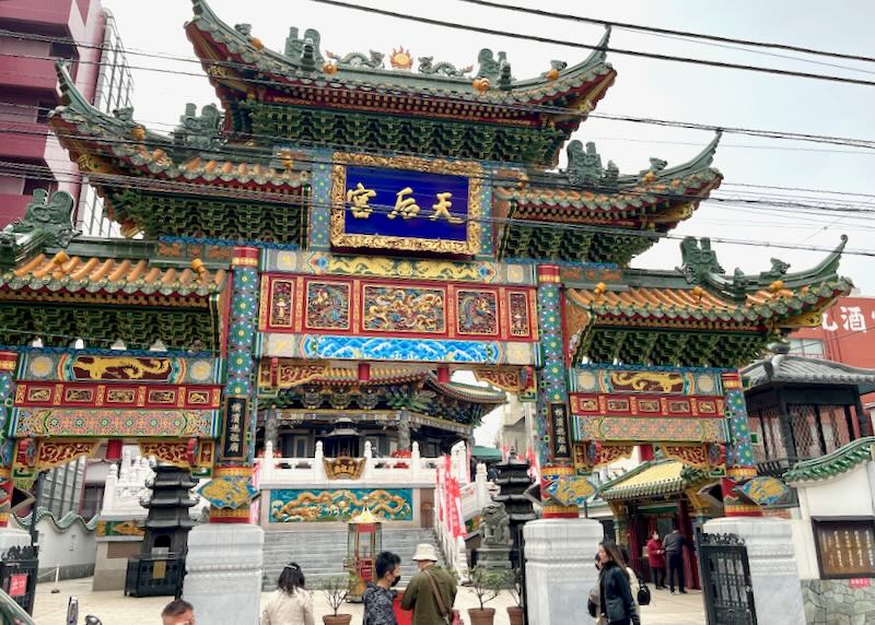 A colorful ornate temple sits in Chinatown.