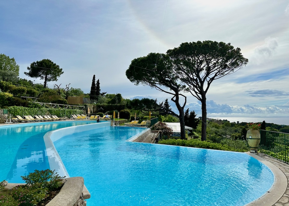 Two-tiered swimming pool set in a garden and facing the sea at Hotel Caesar Augustus in Anacapri on Capri Island