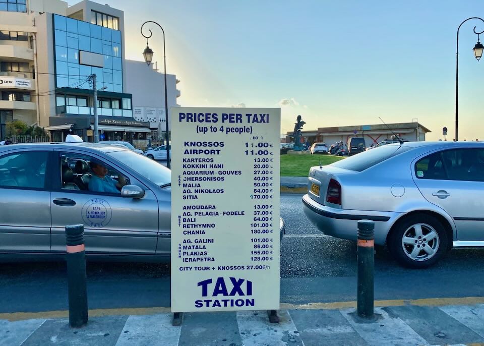 Sign showing taxi rates from Rethymno port
