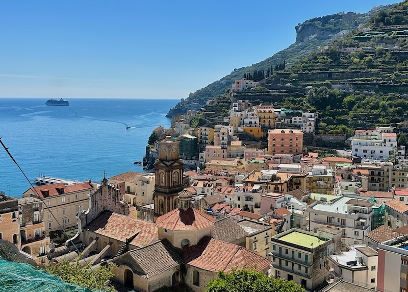 Red tile roofs, a basilica, and a bell tower in the small but dense Minori town on the sea on the Amalfi Coast