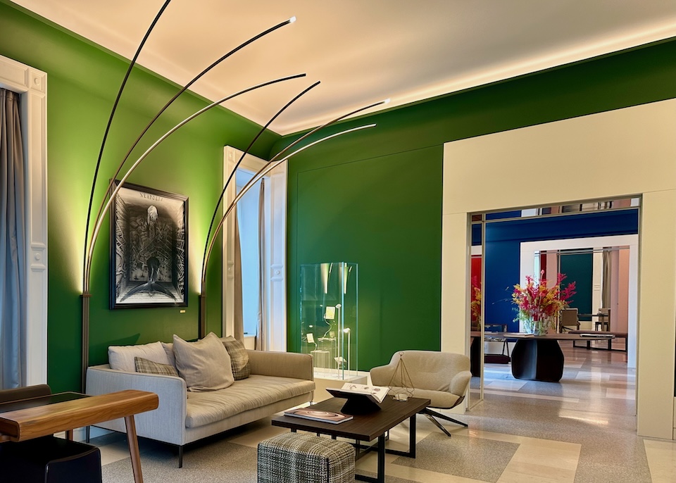 Contemporary style furnishings and floor lamps at the colorful Britannique hotel in Naples.
