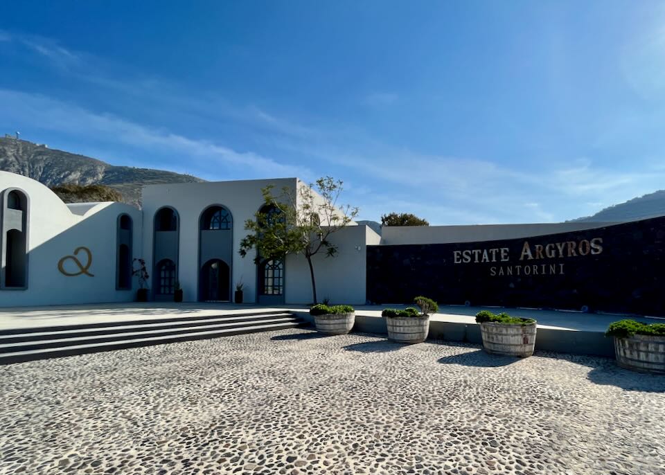 Exterior of Estate Argyros winery, with winery sign