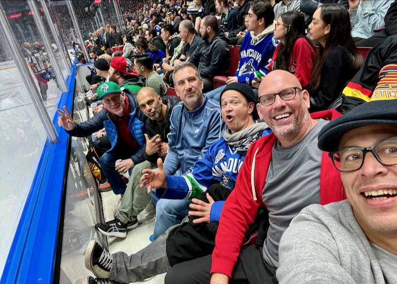 Attending Canucks game in Vancouver.